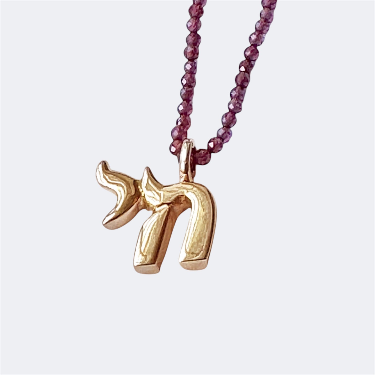 Small Bronze Chai Pendant With Garnet Beads