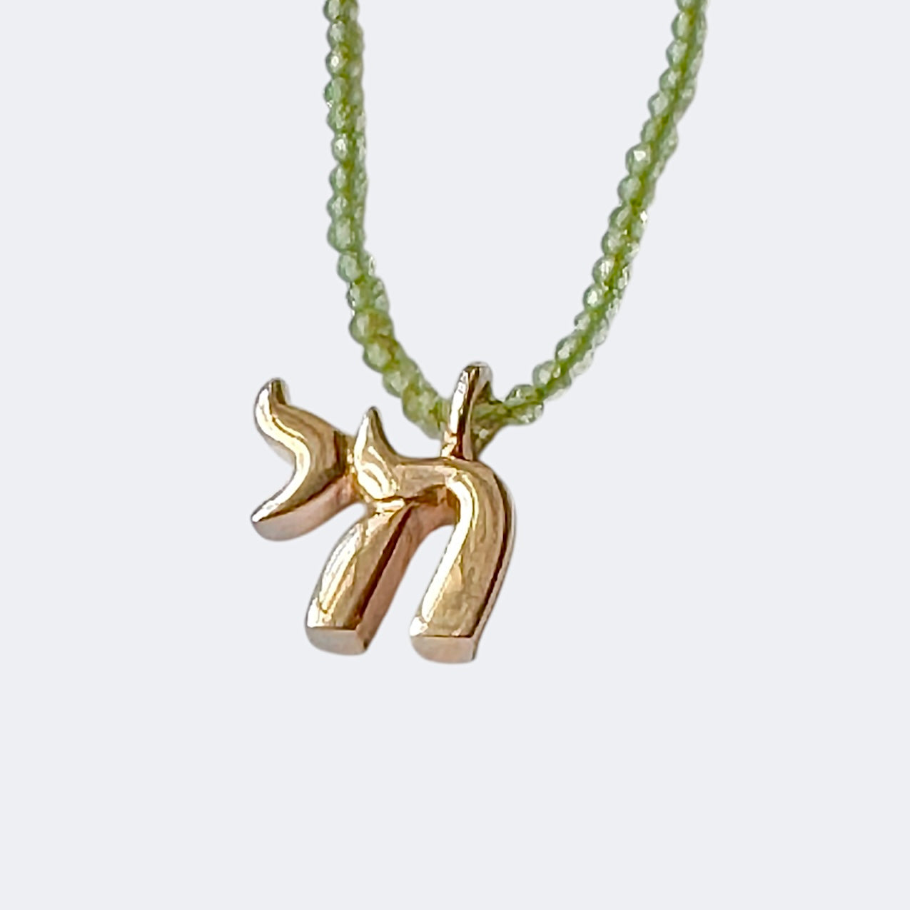 Small Bronze Chai Pendant With Peridot Beads