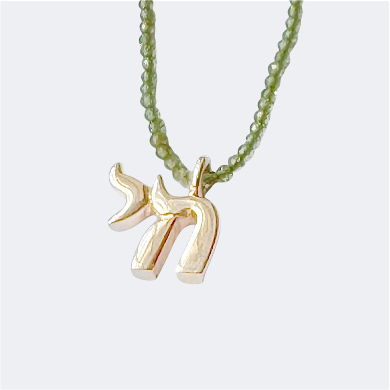 Small Sterling Silver Chai Pendant With Peridot Beads