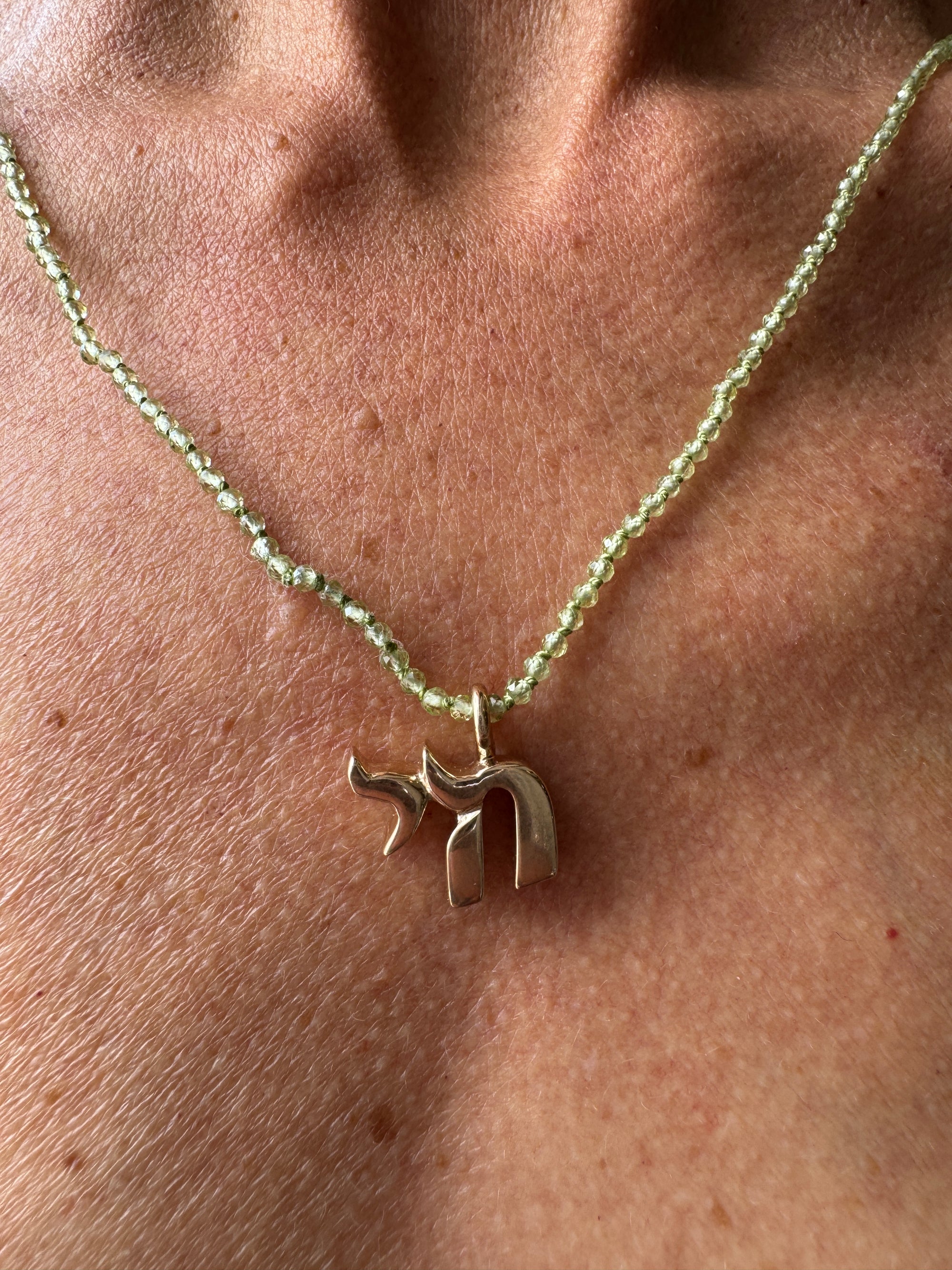 Small Bronze Chai Pendant With Peridot Beads